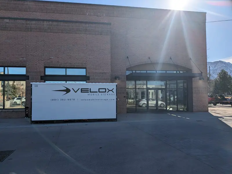 Velox portable storage unit in front of commercial building