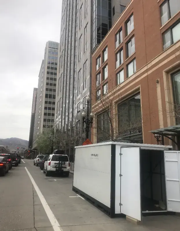 velox portable storage unit in front of commercial office building
