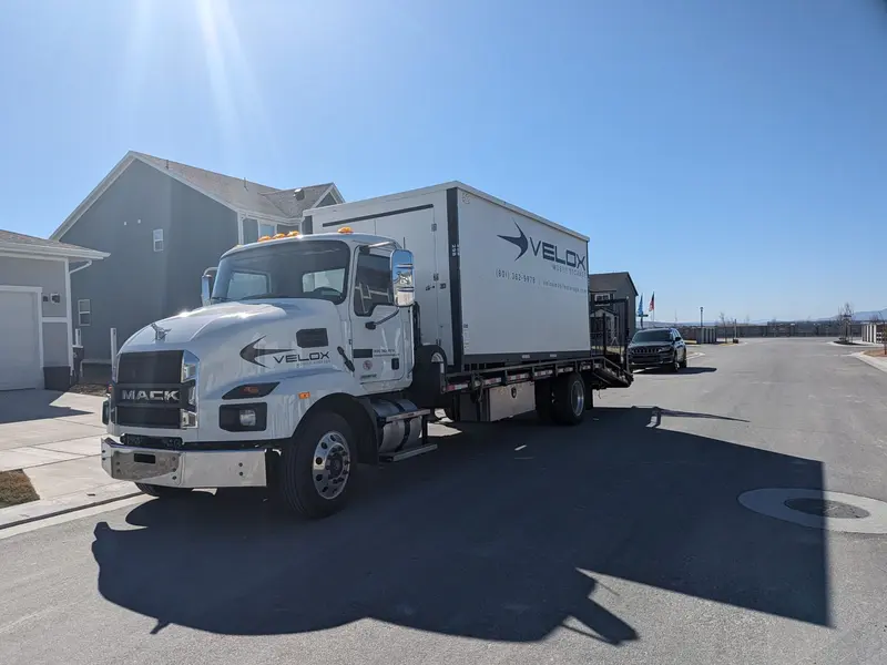Velox truck delivering portable storage unit