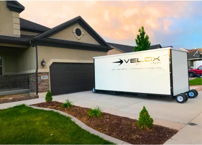 Velox storage container in residential driveway