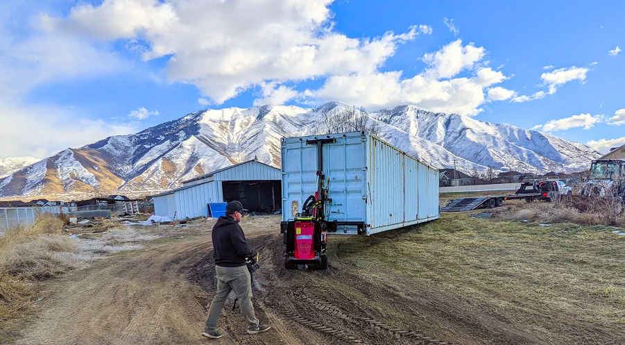 shipping container being moved