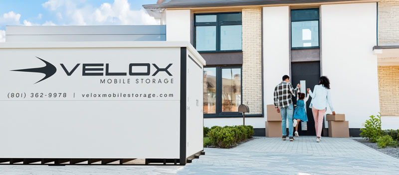 family packing and moving with Velox portable storage container