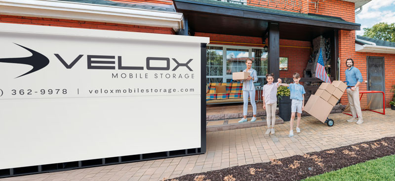 family packing and moving with Velox portable storage container
