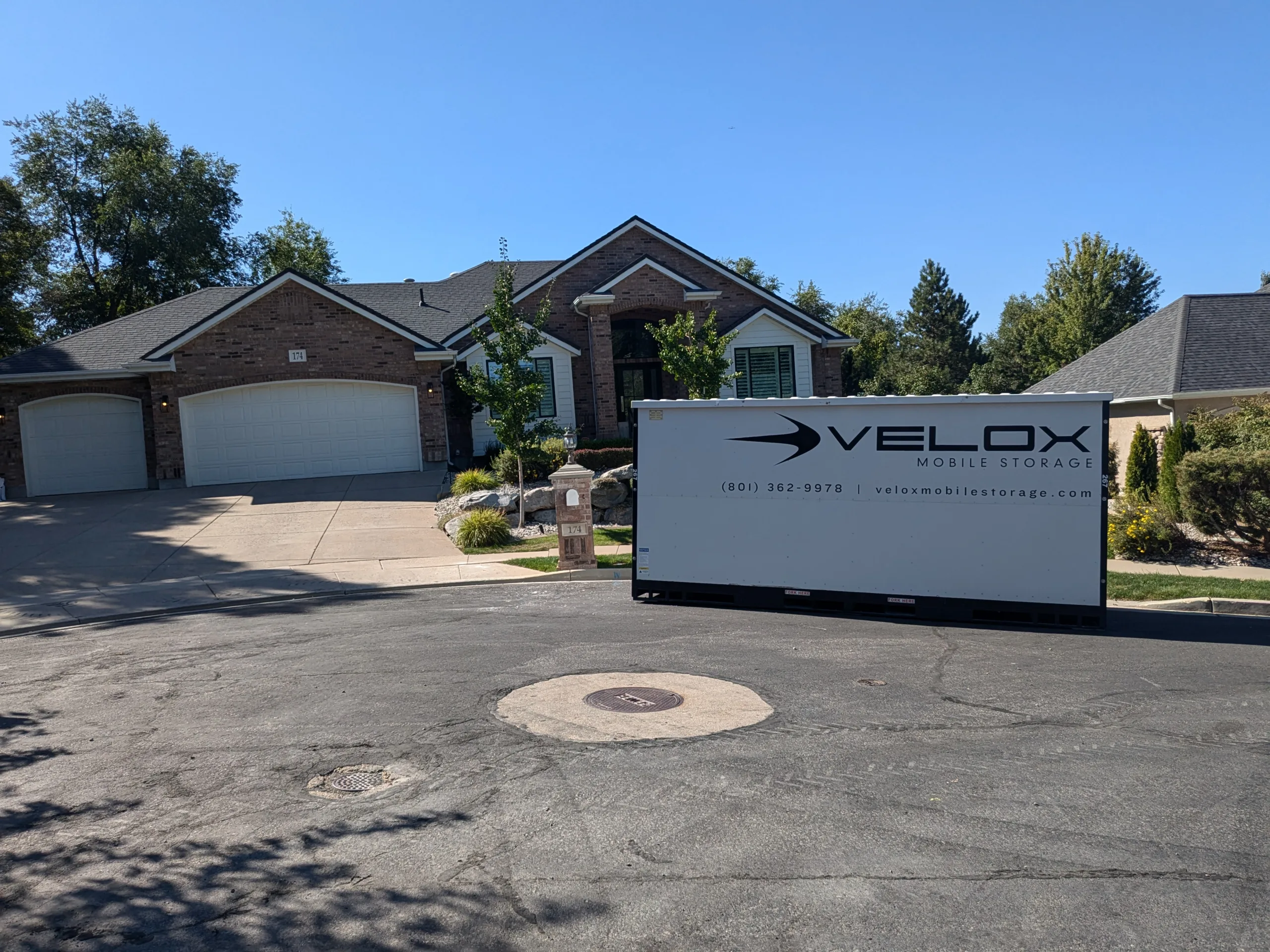 A Velox Mobile Storage container delivered in front of a home