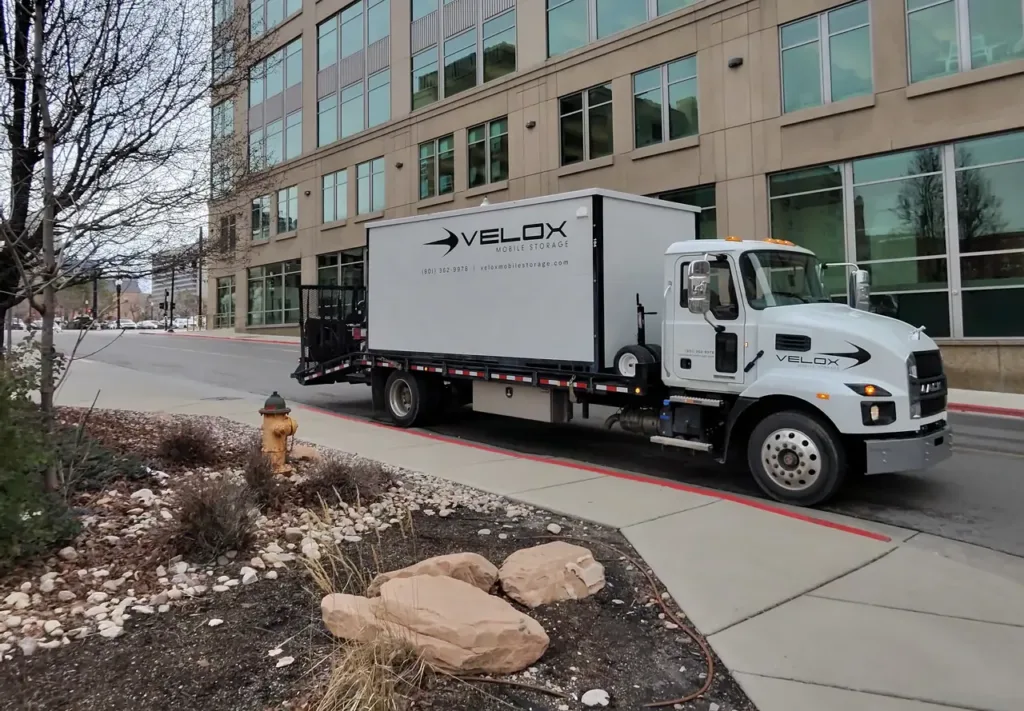 Velox delivery truck carrying a portable storage container in Salt Lake City, Utah